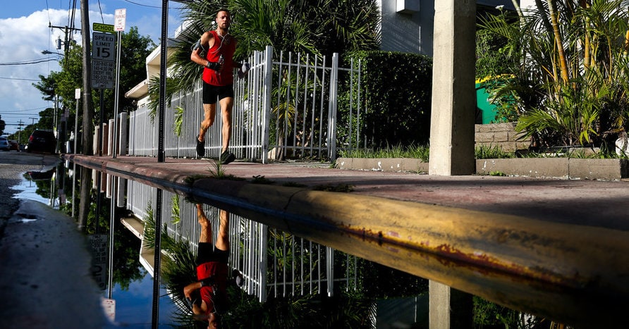 A man jogged through Miami Beach on Friday. The five new Zika cases there included two Florida residents and three people who had traveled to the area, Gov. Rick Scott said. Credit Scott McIntyre for The New York Times