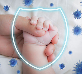 Parent holding baby's hand with protective shield icon.