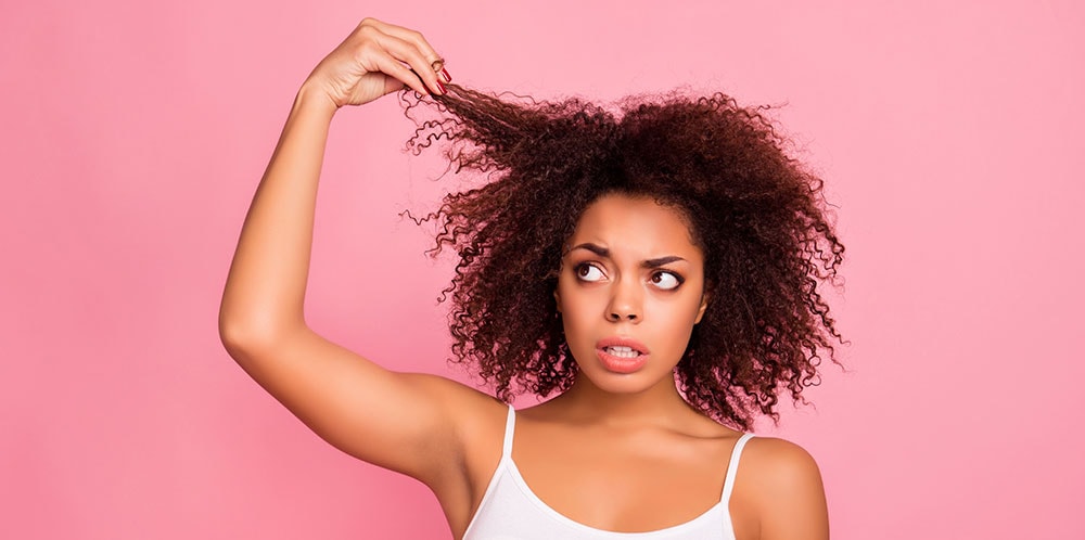 Stressed woman pulling on hair