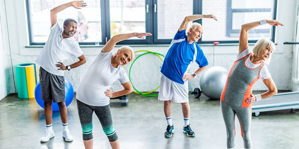 Elderly exercise group stretching