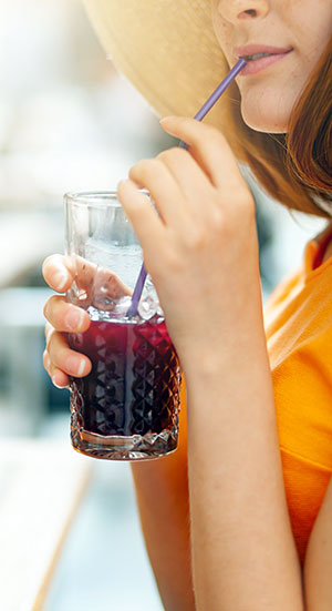 Woman drinking cranberry juice