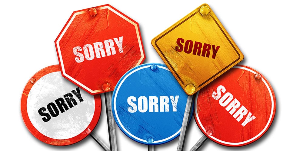 Five traffic signs that say "Sorry"