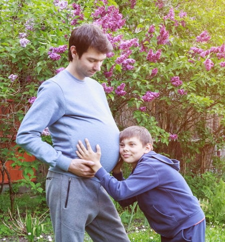 Pregnant man with his son