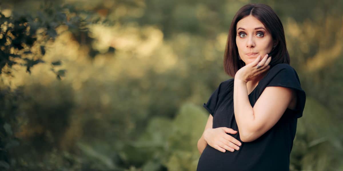 Pregnant woman holding breath to stop hiccups