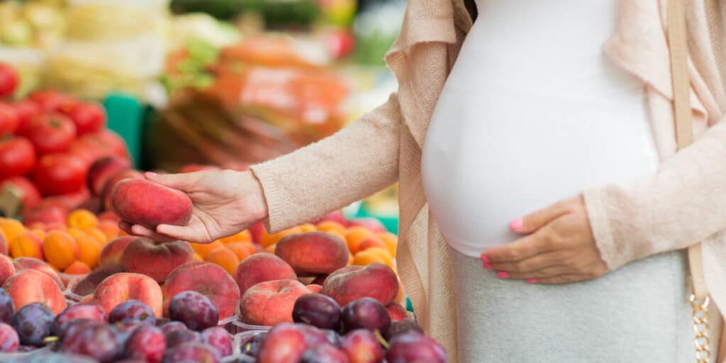 Pregnant Woman Buying Healthy Food