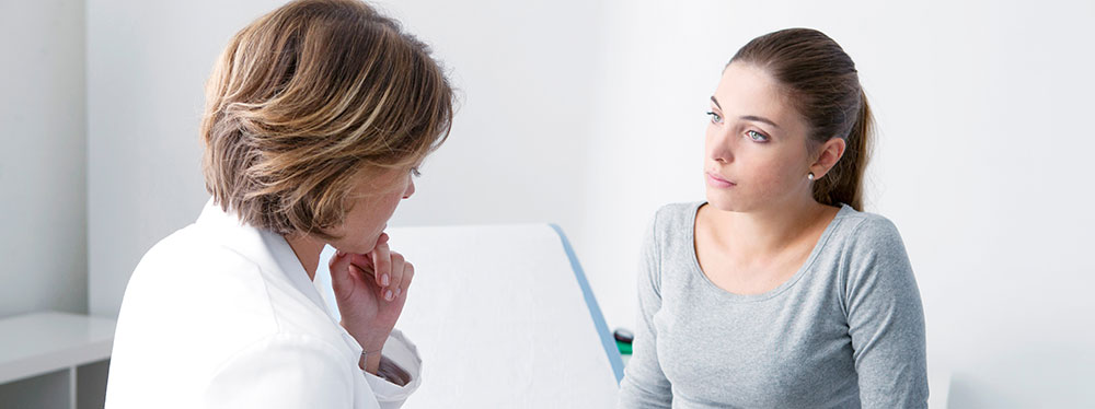Woman talking with gynecologist