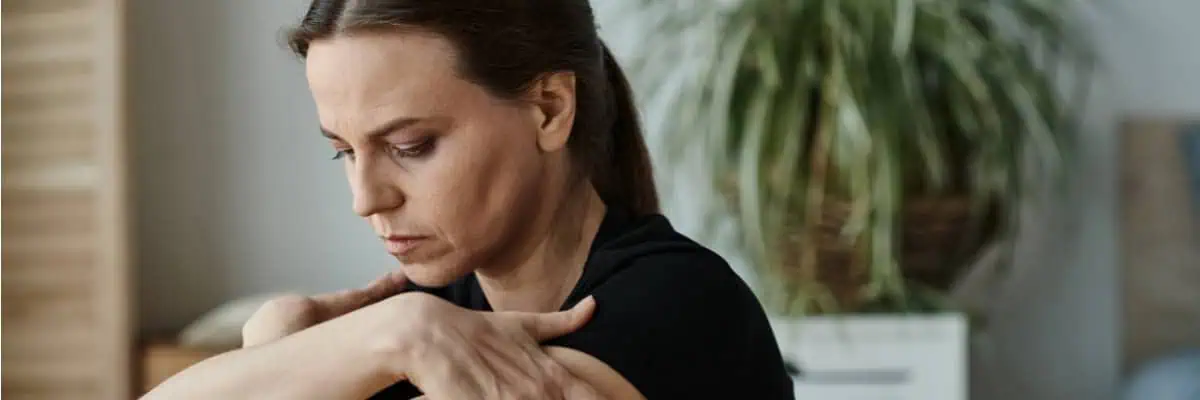 1. Woman experiencing shoulder pain, healthcare, injury, wellness, health, chiropractor, physical therapy, musculoskeletal health, active lifestyle, pain relief.