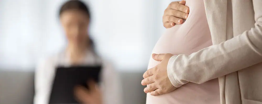 Pregnant woman with doctor