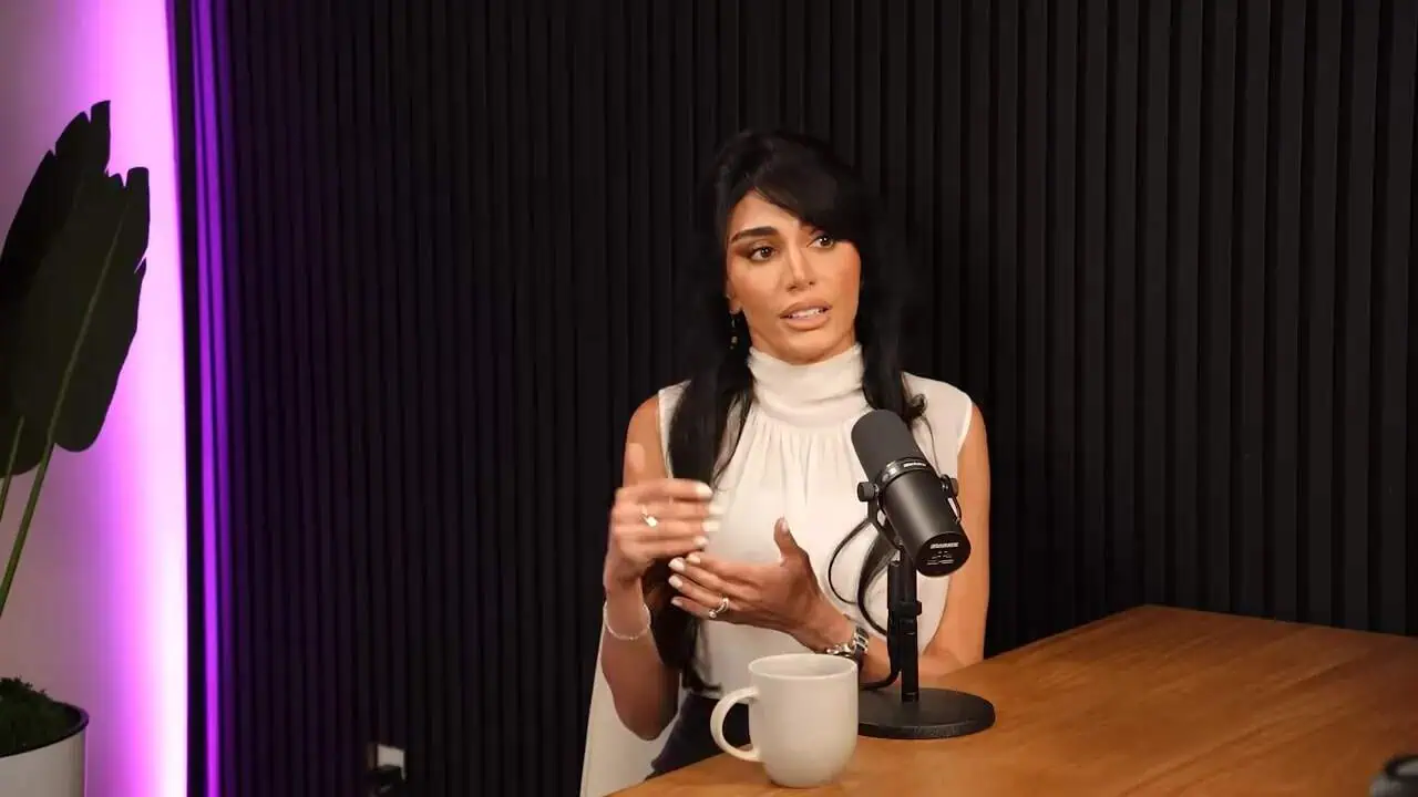 Thais Aliabadi MD speaking during a podcast interview in a professional setting.