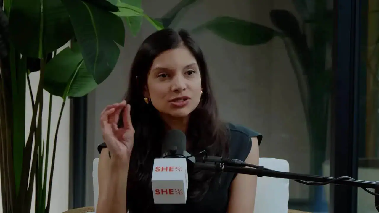 Dr. Thais Aliabadi MD speaking at an event, professional portrait.