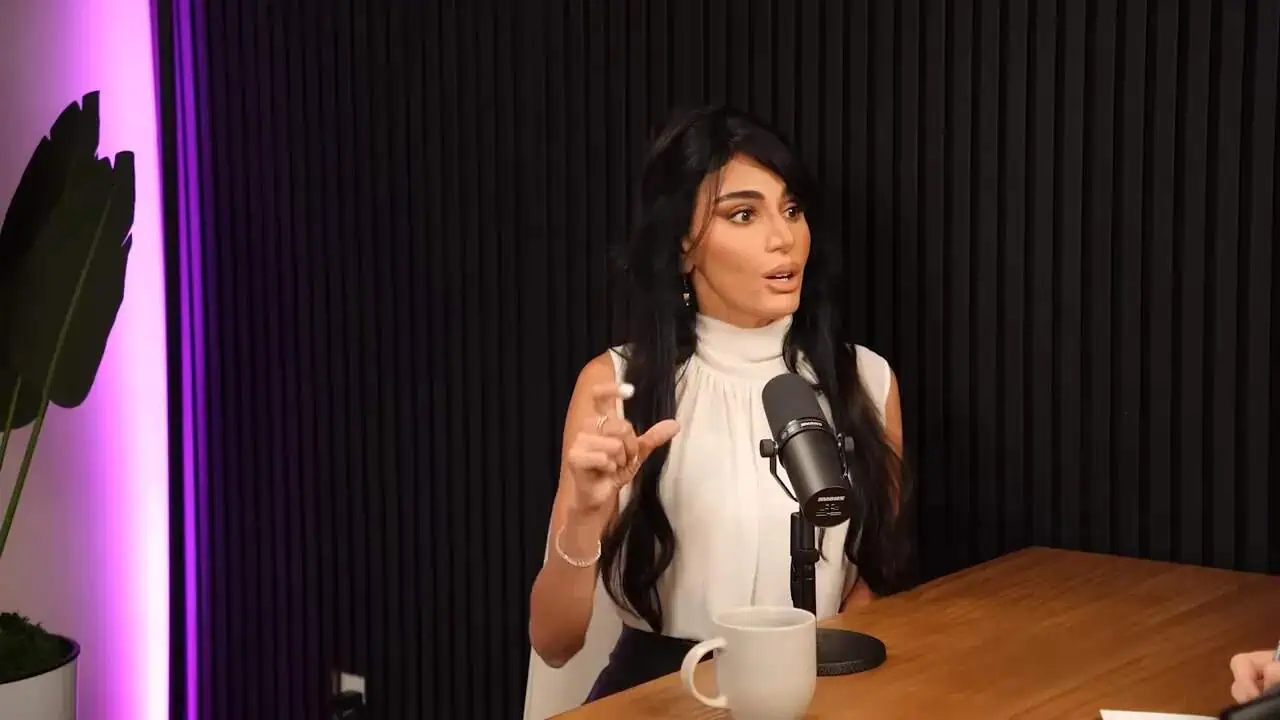 Dr. Thais Aliabadi MD speaking during a podcast interview in a professional setting.