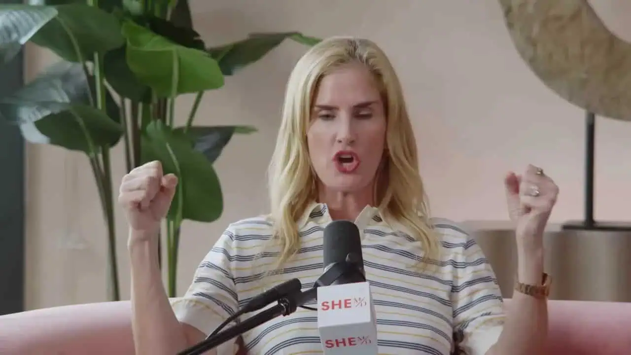 Woman speaker advocating for women's health and empowerment.