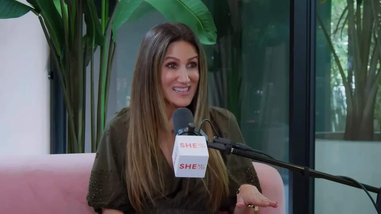 Dr. Thais Aliabadi MD speaking at an event, promoting her medical expertise and patient care.