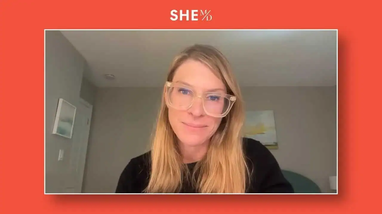 Thais Aliabadi MD, healthcare expert, smiling woman with glasses in a professional setting.