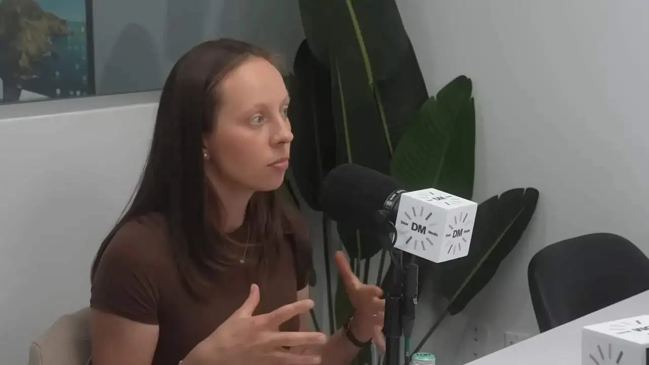 Thais Aliabadi MD speaking into microphone during interview.