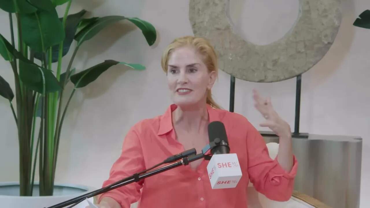 Dr. Thais Aliabadi MD speaking at a medical conference or seminar.