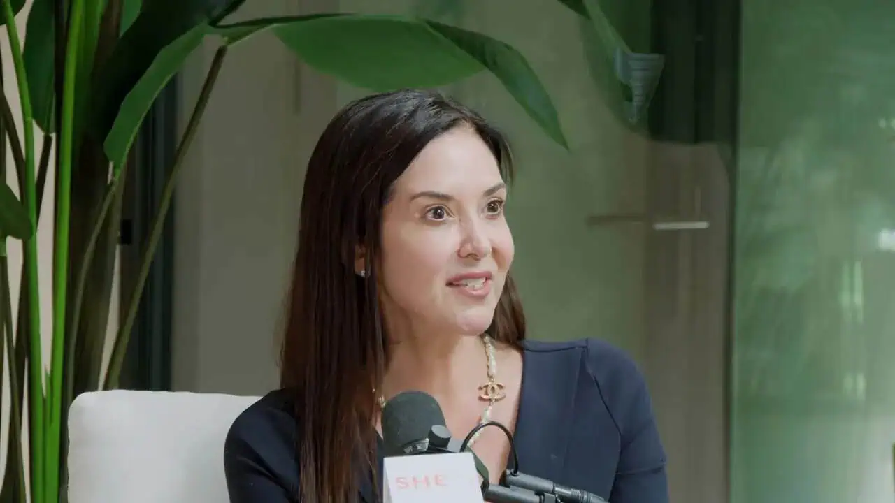 Dr. Thais Aliabadi speaking at a medical event, professional healthcare provider.