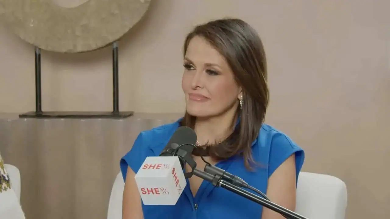 Dr. Thais Aliabadi speaking at a press event or interview.