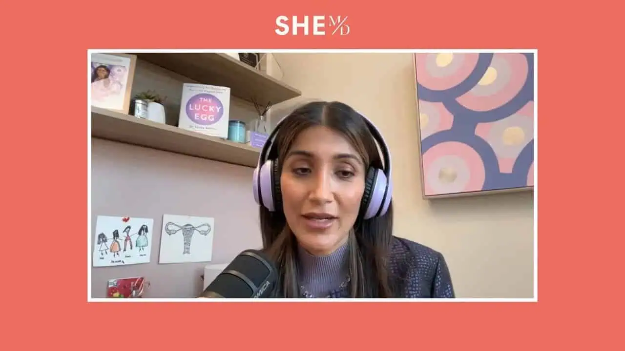 Thais Aliabadi MD during a telemedicine consultation, wearing headphones and speaking to a patient.