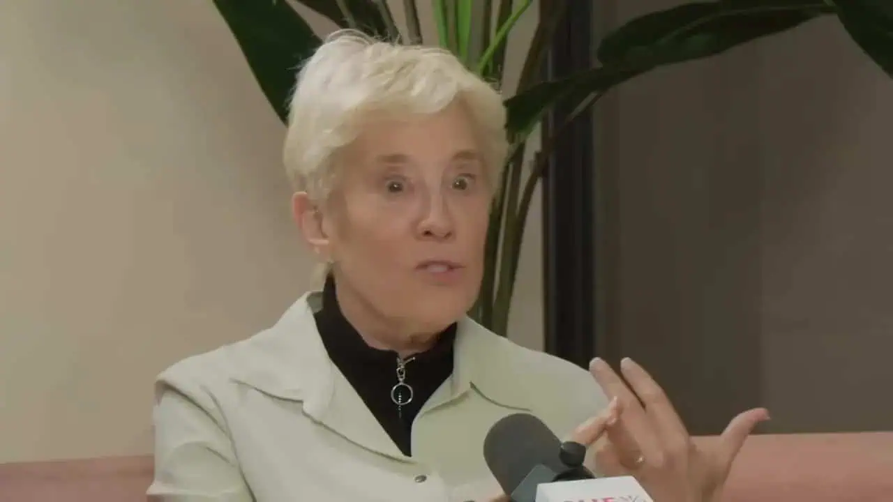 Expert female doctor discussing health topics during interview.