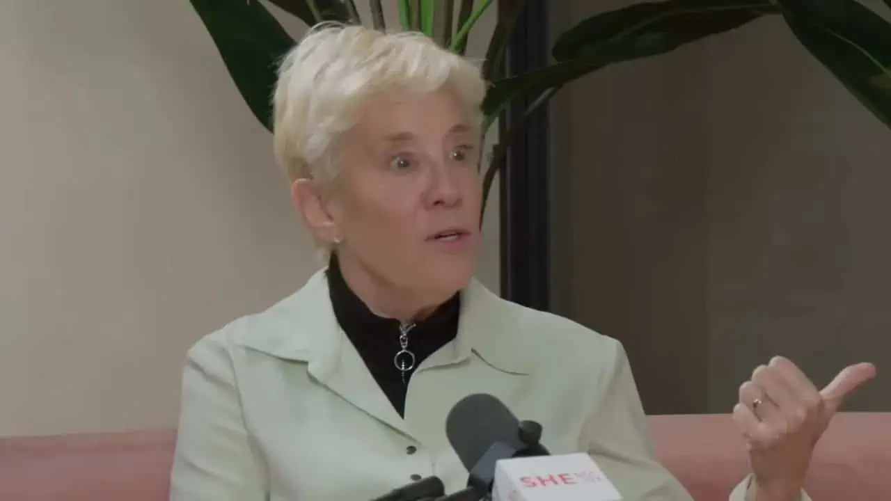 Portrait of Thais Aliabadi MD, a medical professional, speaking during an interview.