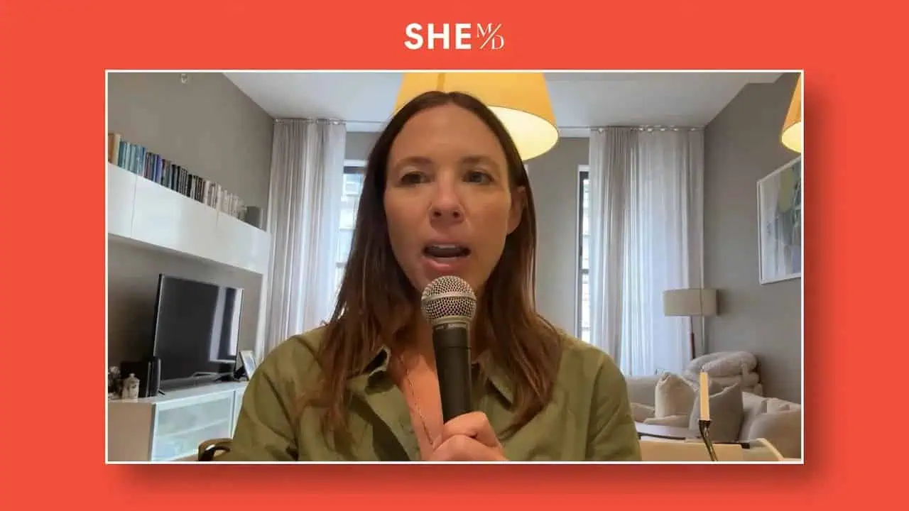 Thais Aliabadi MD speaking into a microphone in a modern living room.