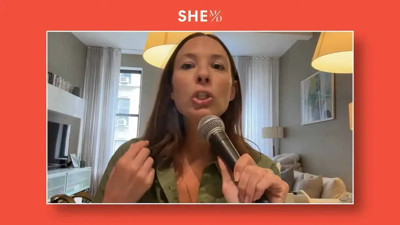 Thais Aliabadi MD speaking into microphone in a modern clinic setting.