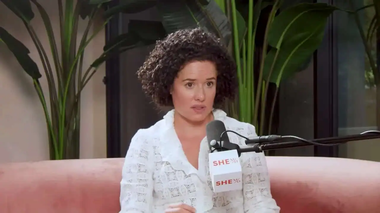 Dr. Thais Aliabadi MD speaking at an event, professional portrait.
