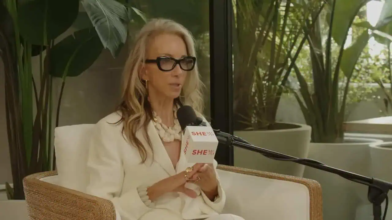 Dr. Thais Aliabadi MD speaking into microphone during media interview.
