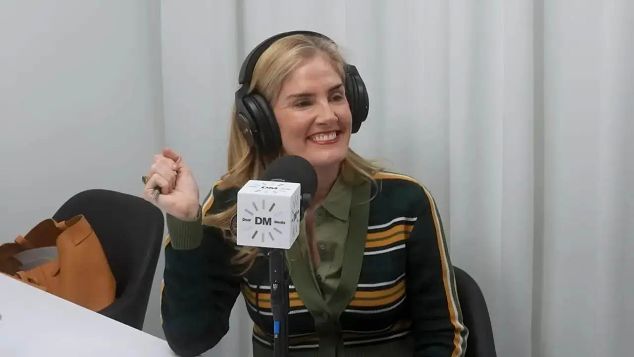 Thais Aliabadi MD smiling during a medical podcast recording.
