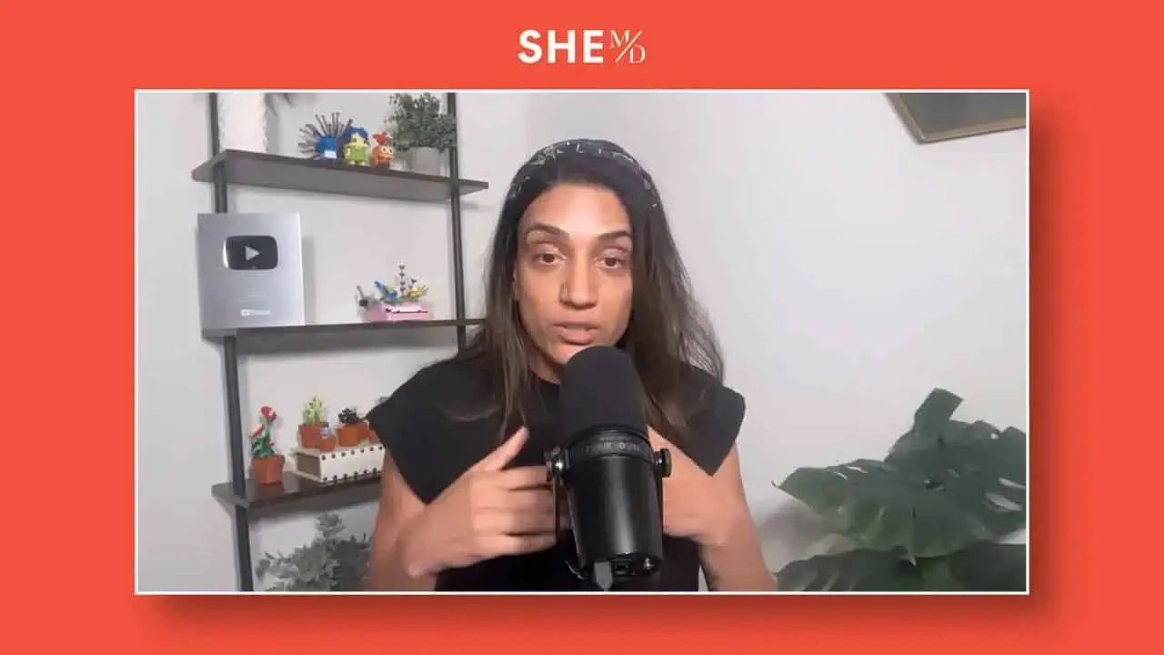 Thais Aliabadi MD speaking into a microphone in a professional setting.