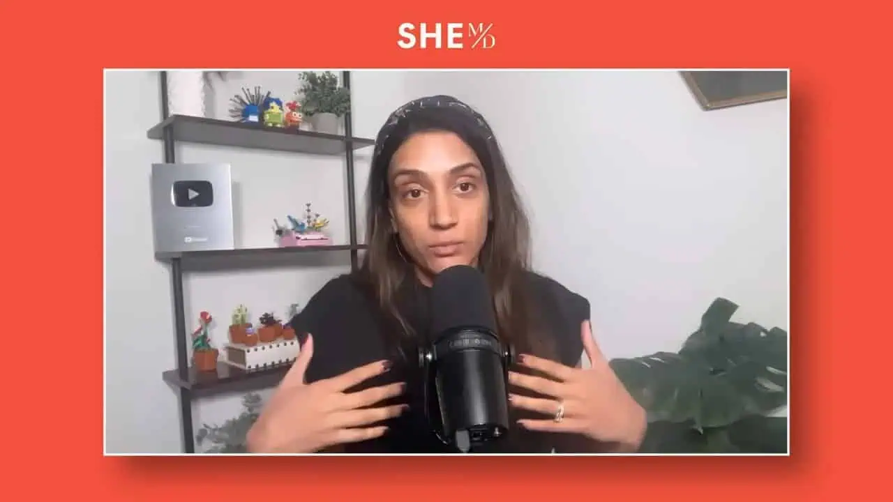 Thais Aliabadi MD speaking into a microphone in a professional setting.