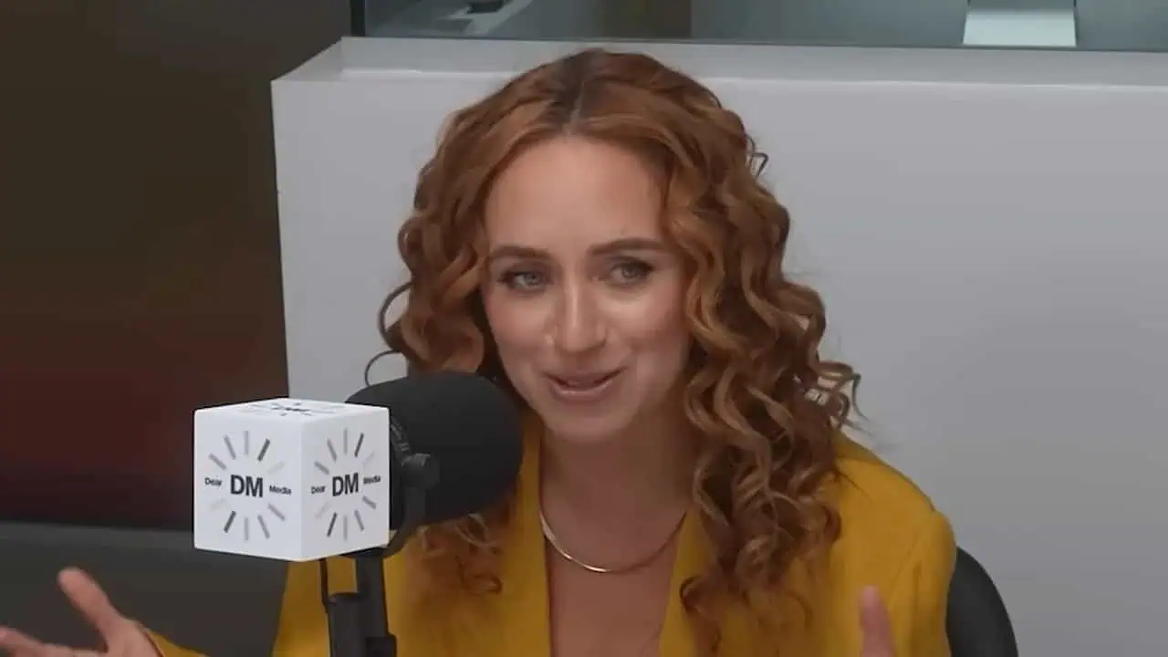 Katerina Schneider speaking into a SHE MD microphone