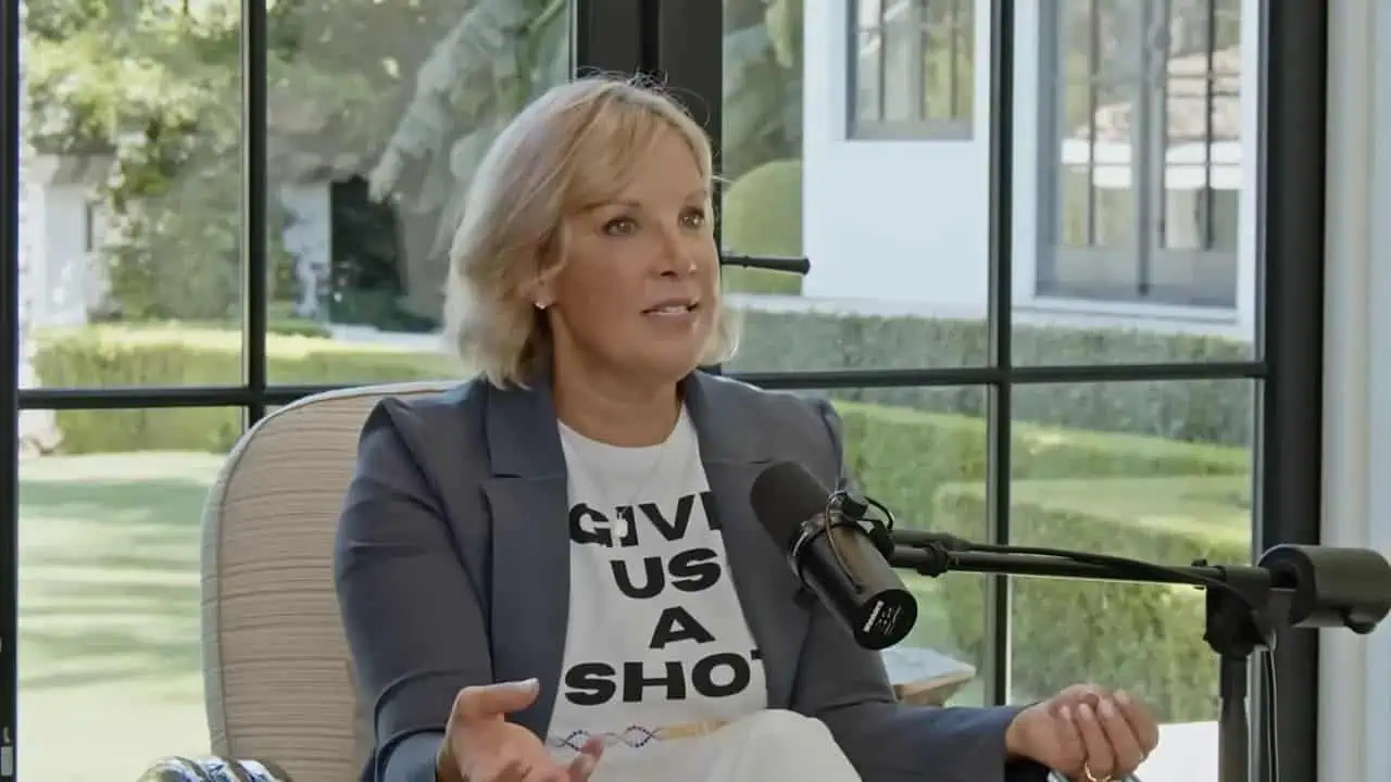 Thais Aliabadi MD speaking during an interview in a modern office setting.