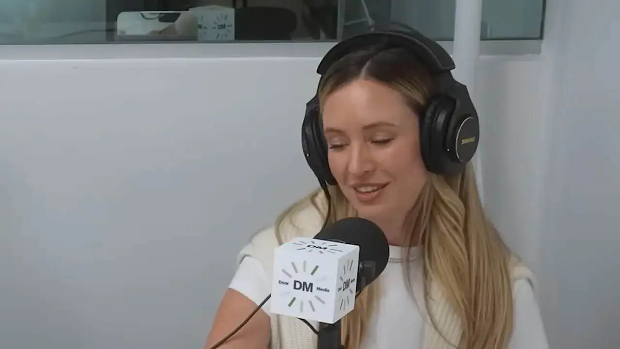 Thais Aliabadi MD speaking into microphone during podcast recording.
