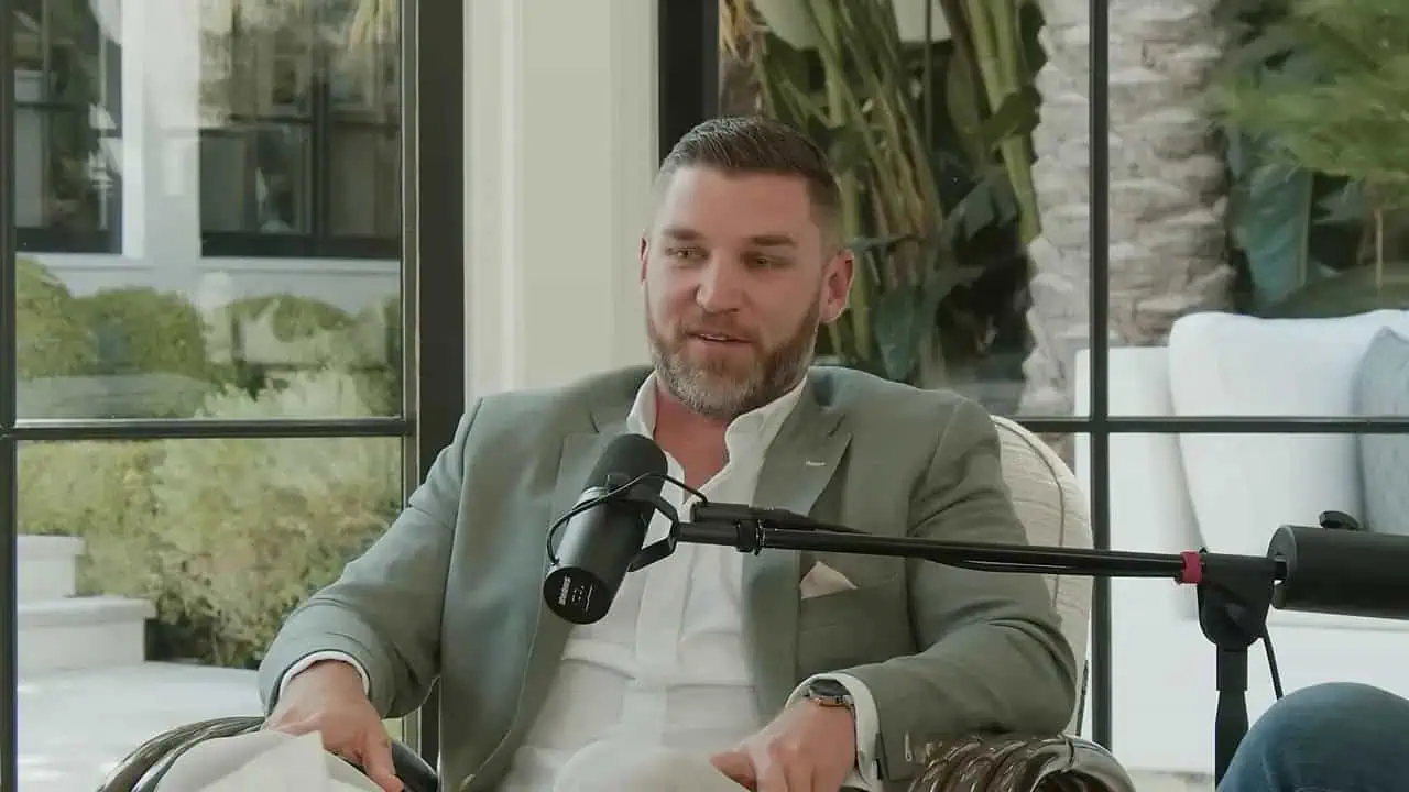 Thais Aliabadi MD speaking during an interview in a modern office setting.
