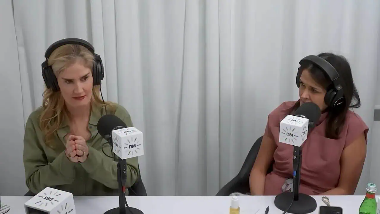 Thais Aliabadi MD and guest in a podcast recording with microphones and headphones.