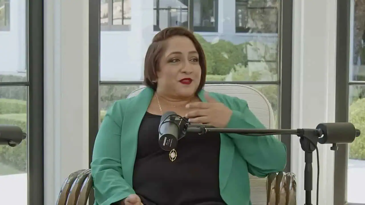 Thais Aliabadi MD speaking during a professional interview or presentation.