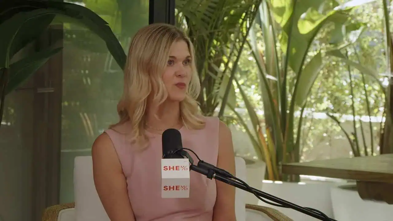 Thais Aliabadi MD speaking at an interview with a microphone.