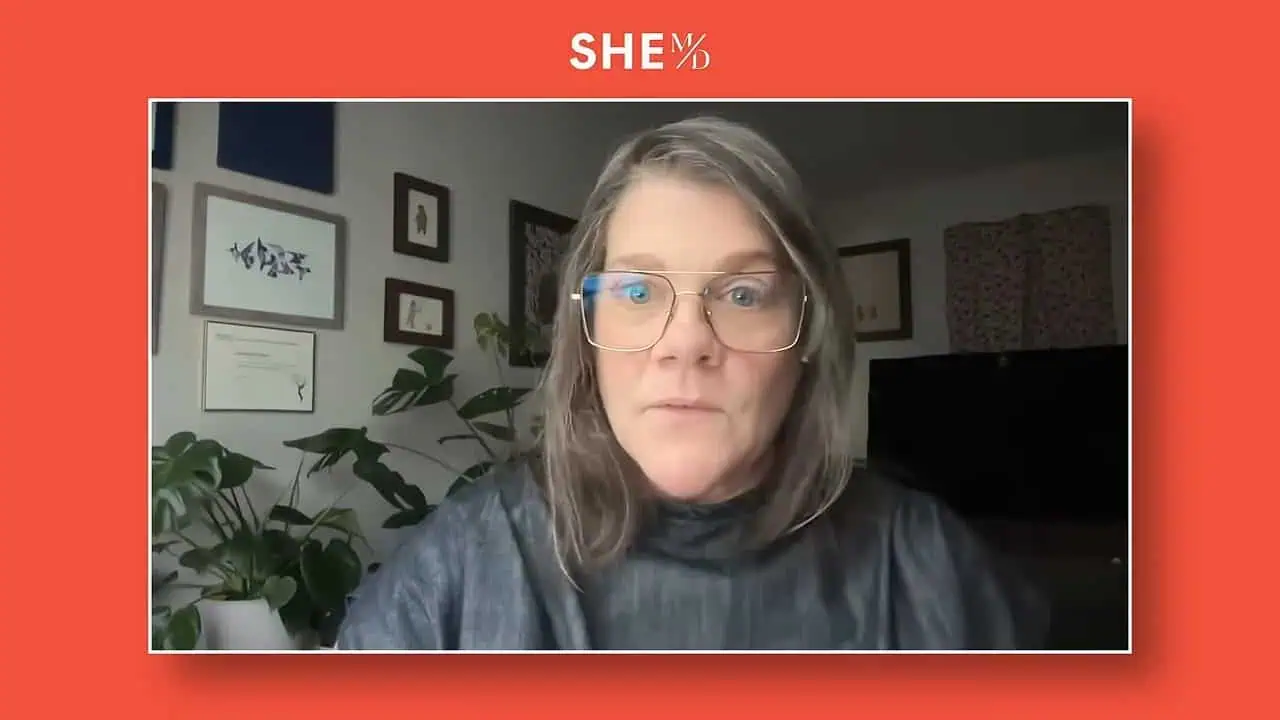 Ami Armstrong speaking in a video call frame with SHE MD branding