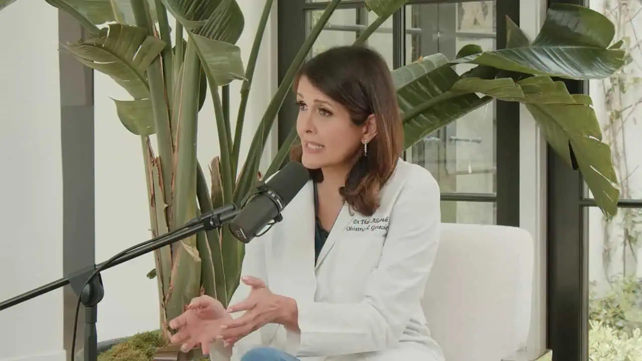 Thais Aliabadi MD speaking at a podcast or interview in a medical setting.