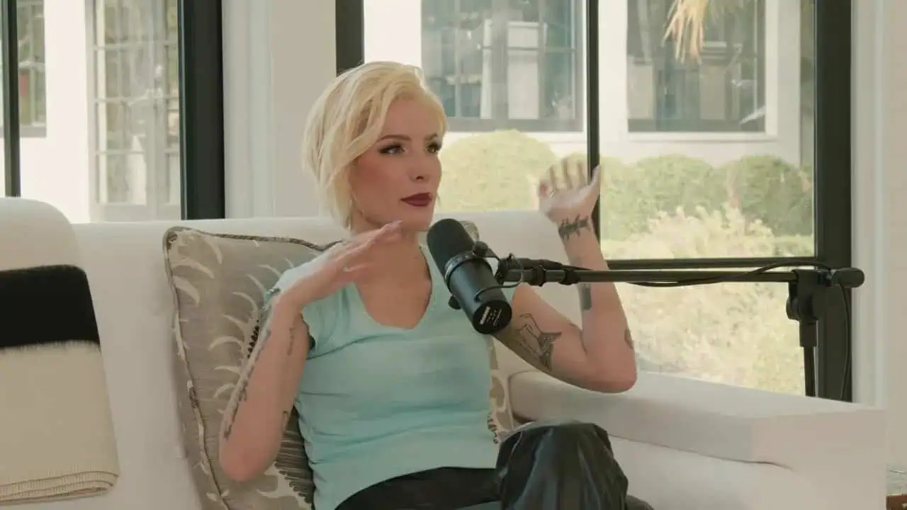 Thais Aliabadi MD speaking into microphone during podcast recording.