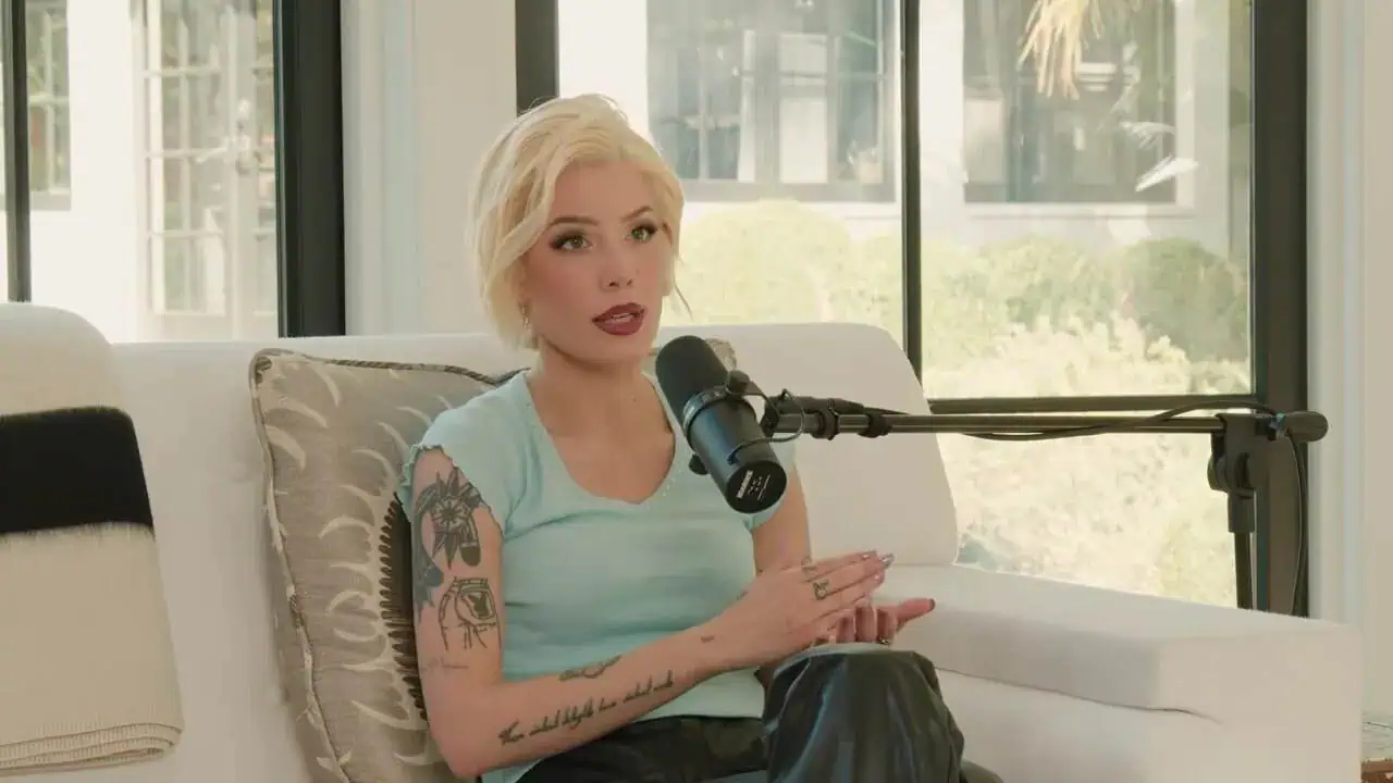 Thais Aliabadi MD speaking into a microphone in a modern office.