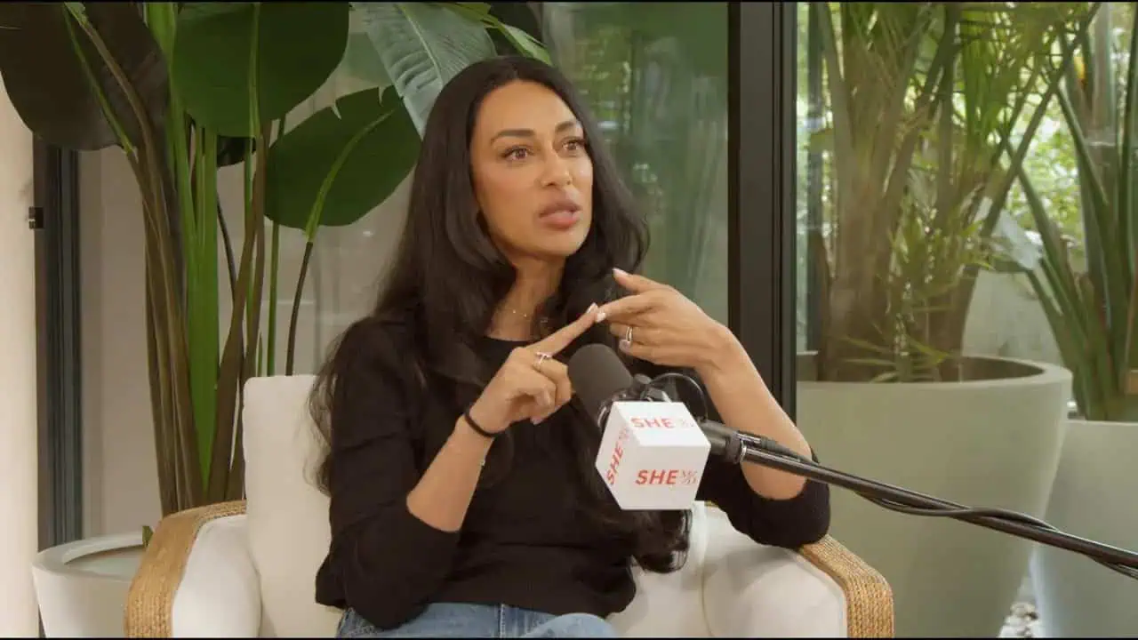 Thais Aliabadi MD speaking during an interview with a microphone.