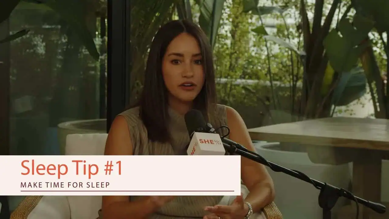 Alexandra Zatarain speaking with a Sleep Tip #1 banner